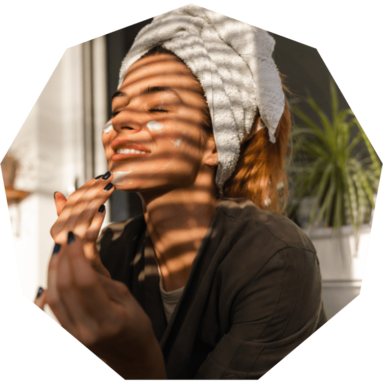 Woman putting on face mask